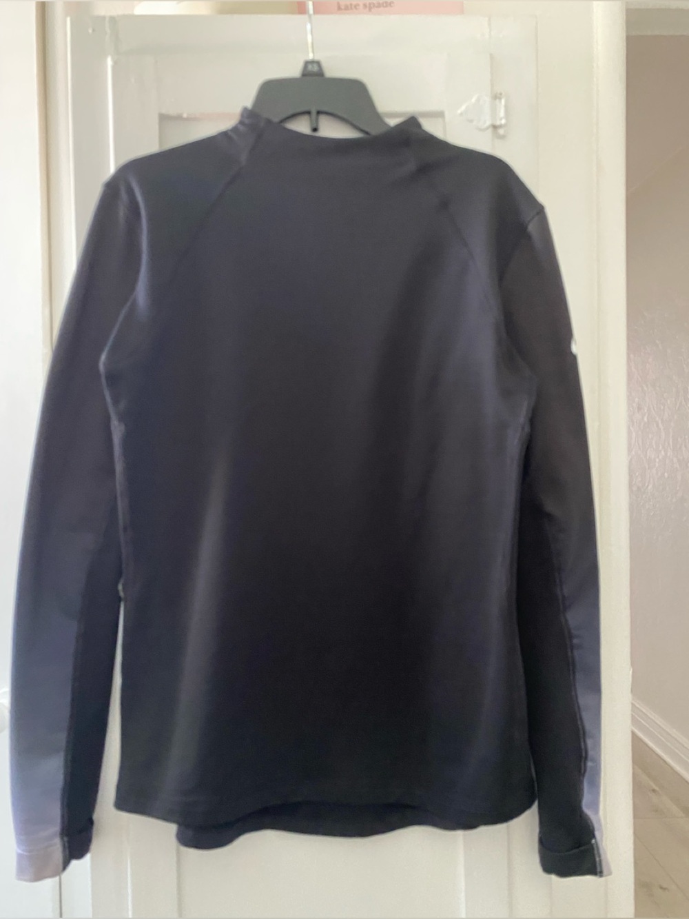 Nike excellent top, has colors running down sleeves -